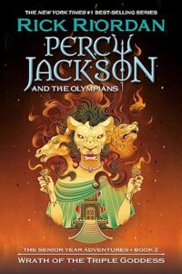 Cover of Percy Jackson and the Olympians: Wrath of the Triple Goddess featuring a three-headed lion figure standing in front of a mystical temple, with flames rising against a dark background.