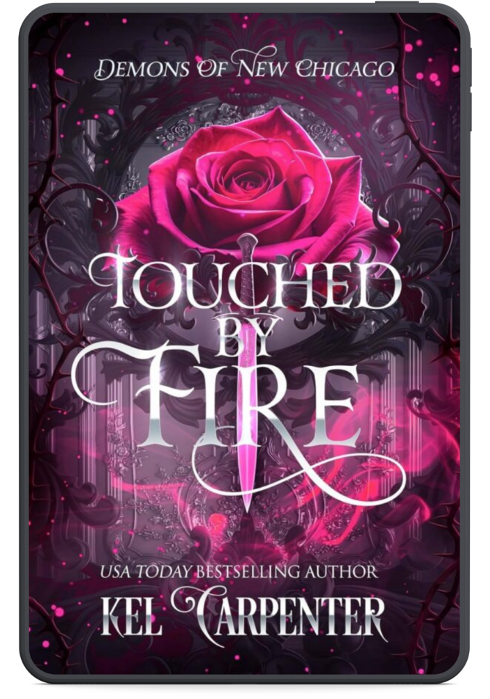Touched by Fire by Kel Carpenter book cover featuring a vivid pink rose, black gothic filigree, and a silver dagger.